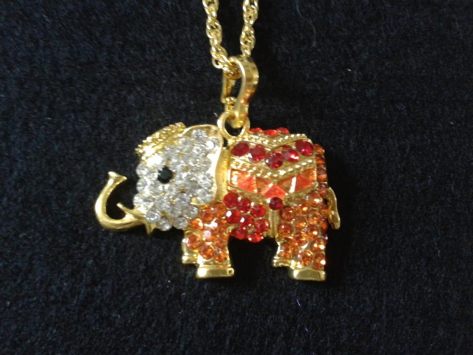 BRINGS GOOD FORTUNE THIS BEAUTIFUL GARNET STONES AND CLEAR CRYSTAL ELEPHANT...£8-99